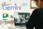 Uma pessoa está usando um laptop para uma videochamada com vários participantes. A palavra "Gemini" está exibida na parede em letras coloridas.